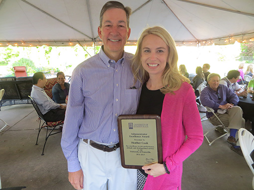 Tom Kazee and Heather Cook Hold Award