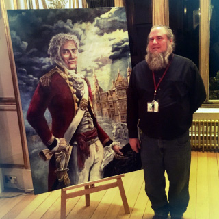 Larmann standing in front of painting of Gregory Gregory
