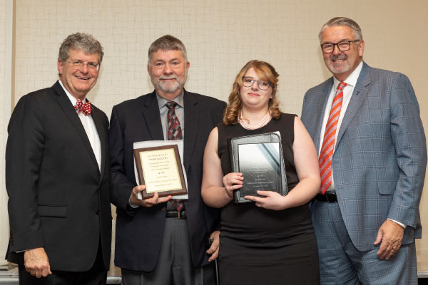 Lyndia Hayes holding award