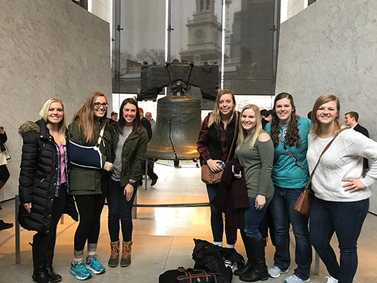Students standing in front of the Liberty Bell