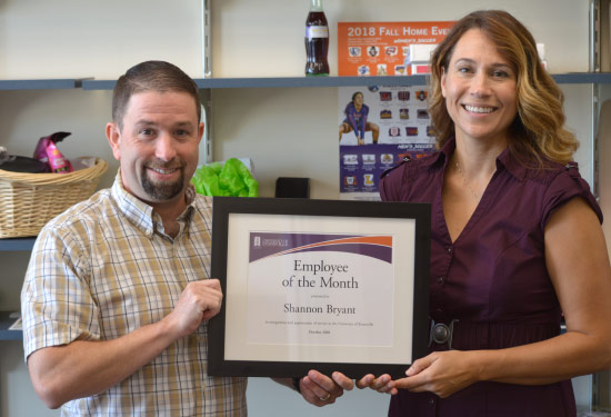 Keith Gehlhausen and Shannon Bryant holding award