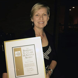 Sharon Kazee holding Award Plaque