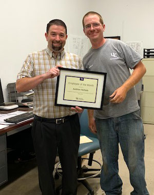 Andrew Nichols with award