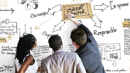 Group of students looking at white board